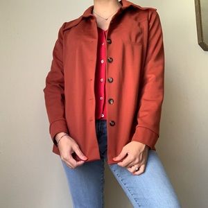 Burnt orange light coat.